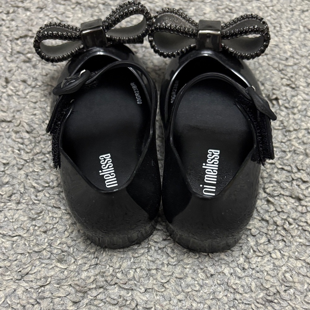 Mini Melissa Black Mary Jane Shoes with Metallic Silver Bow Accent - Picture 2 of 3